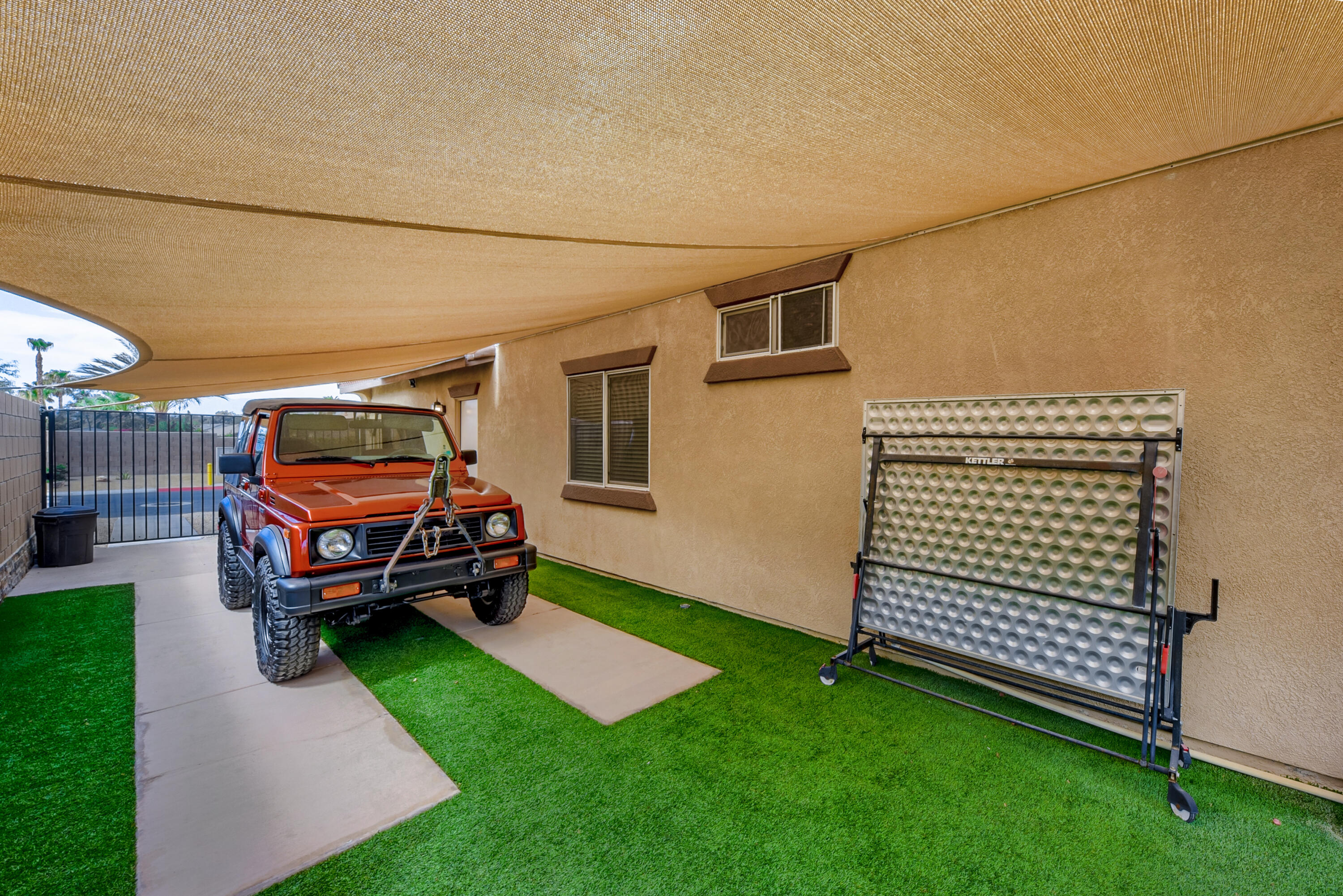 83164 Prairie Dunes Way Indio, CA 92203 - Photo 53 of 60 a car parked in front of a house
