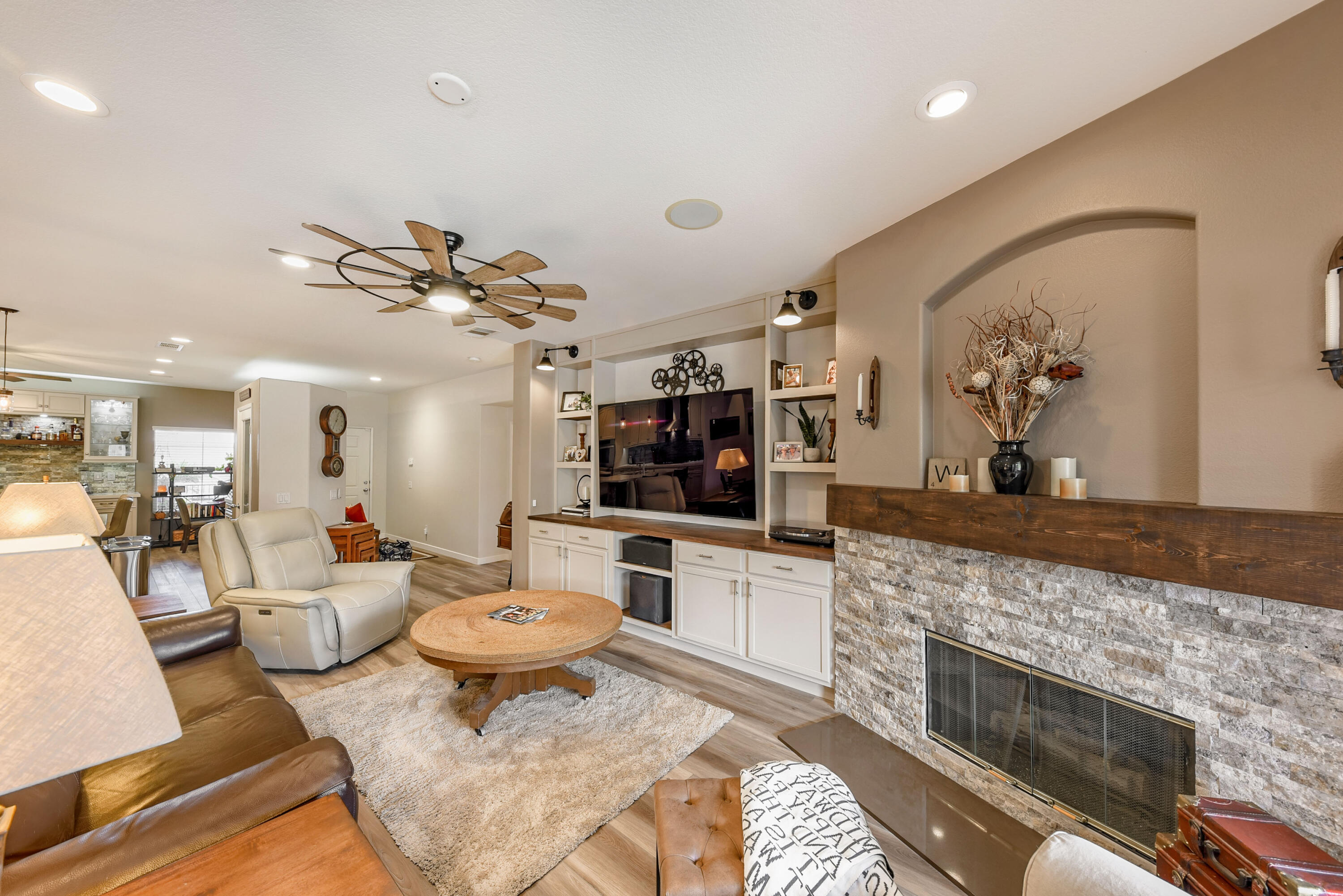 83164 Prairie Dunes Way Indio, CA 92203 - Photo 10 of 60 a living room with furniture kitchen view and a fireplace