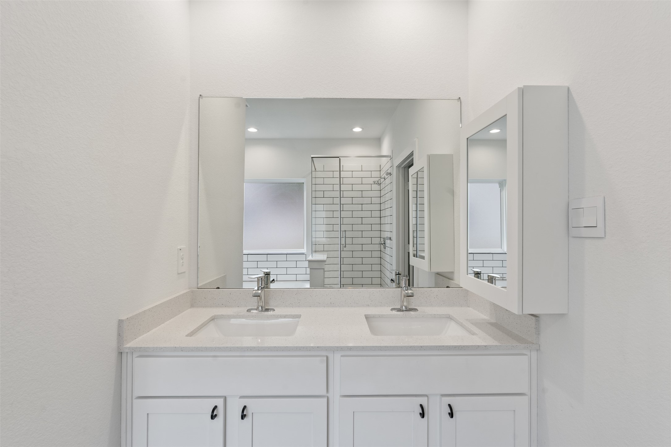 14379 Sweet Mdw Trail Conroe, TX 77384 - Photo 17 of 33 a bathroom with double sink and a mirror