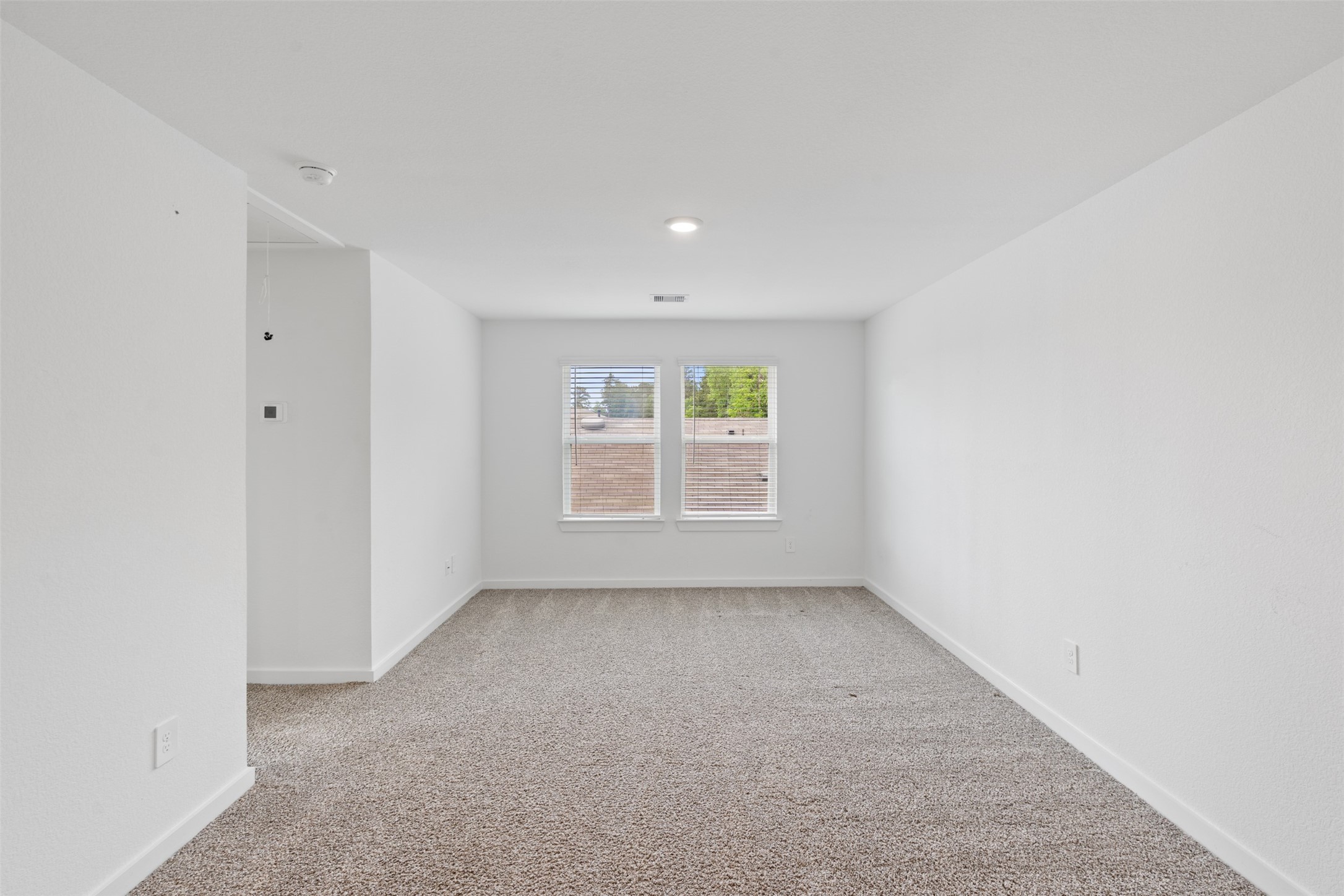 14379 Sweet Mdw Trail Conroe, TX 77384 - Photo 19 of 33 an empty room with windows