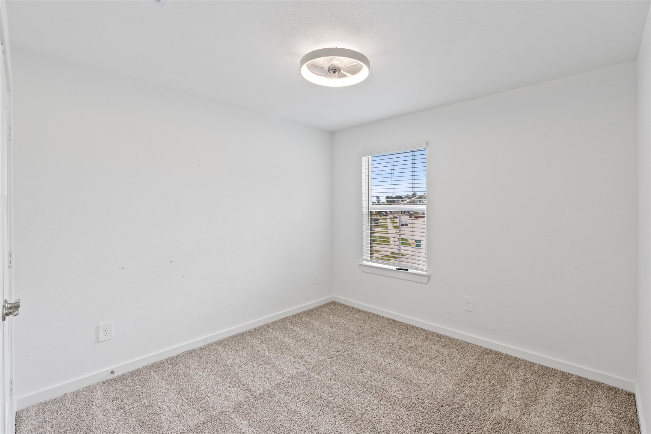 14379 Sweet Mdw Trail Conroe, TX 77384 - Photo 20 of 33 a view of an empty room with a window