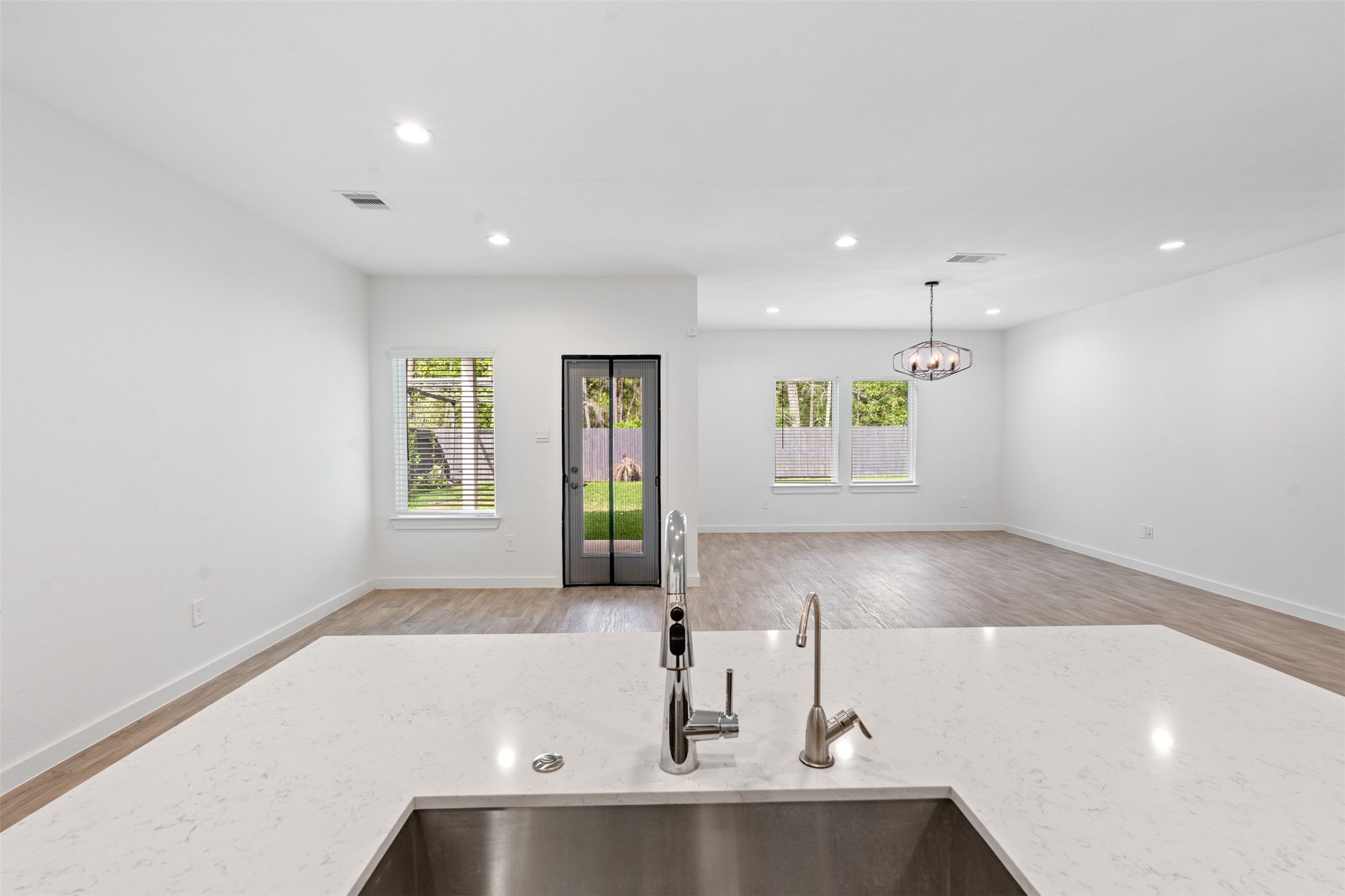 14379 Sweet Mdw Trail Conroe, TX 77384 - Photo 6 of 33 a view of a kitchen with a sink and window