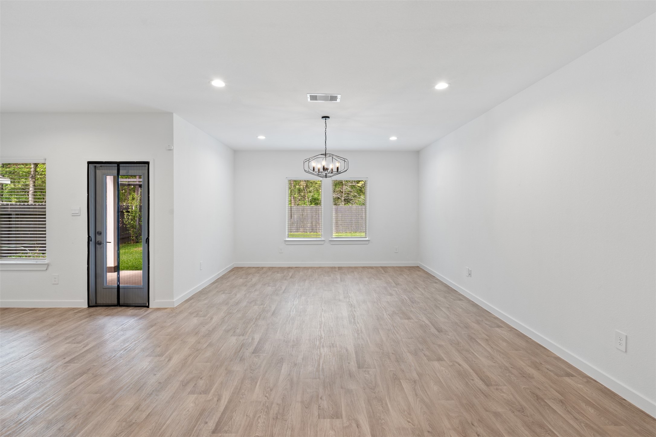 14379 Sweet Mdw Trail Conroe, TX 77384 - Photo 8 of 33 an empty room with window and outdoor view
