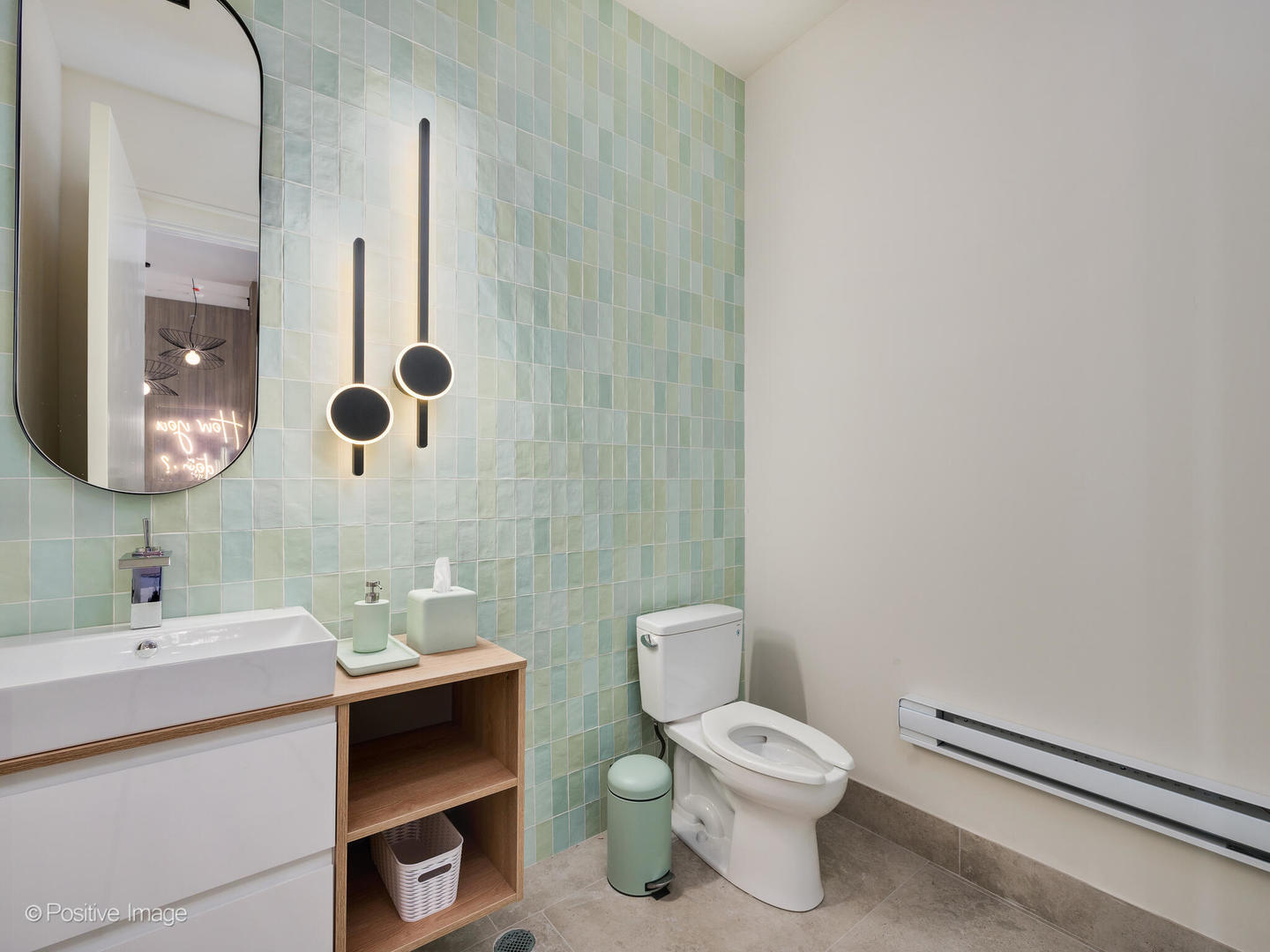 11 West Prospect Avenue, Unit 217 Mount Prospect, IL 60056 - Photo 28 of 66 a bathroom with a toilet sink and mirror