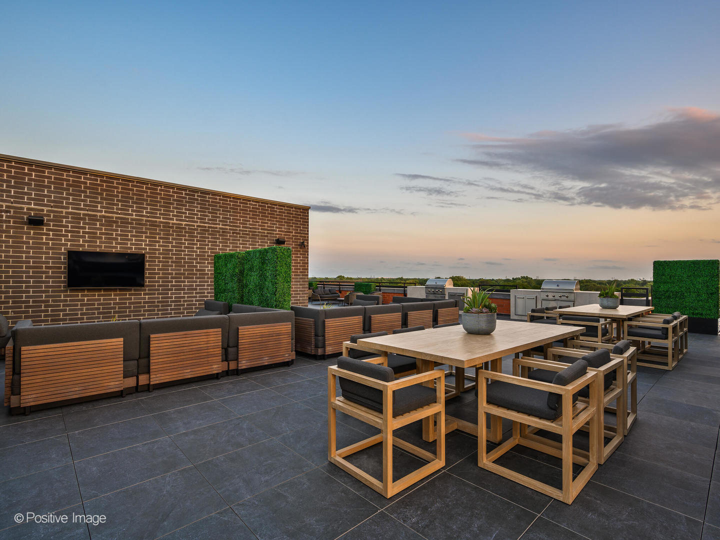 11 West Prospect Avenue, Unit 217 Mount Prospect, IL 60056 - Photo 61 of 66 a terrace with outdoor seating and flat screen tv