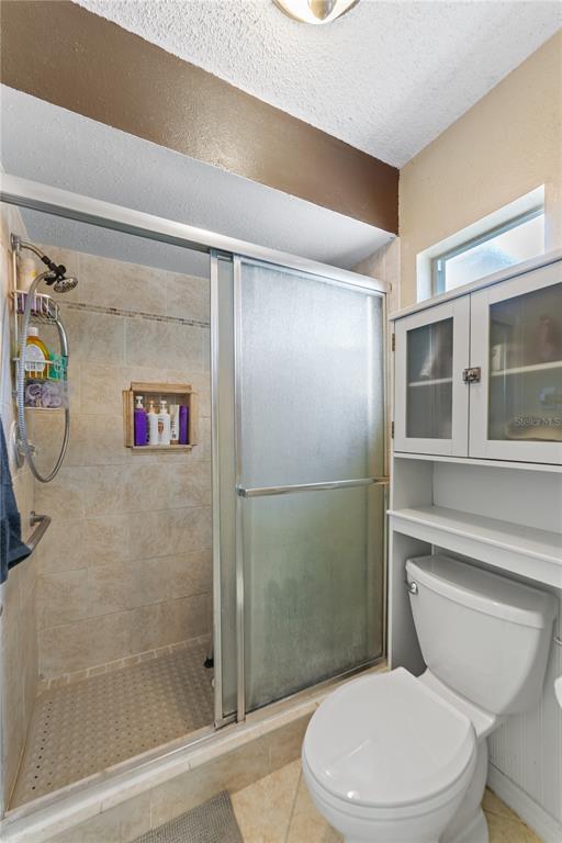 8715 Huntsman Lane Port Richey, FL 34668 - Photo 29 of 54 a bathroom with a toilet and a shower