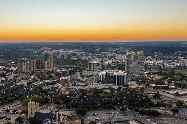 a kitchen with refrigerator and chairs