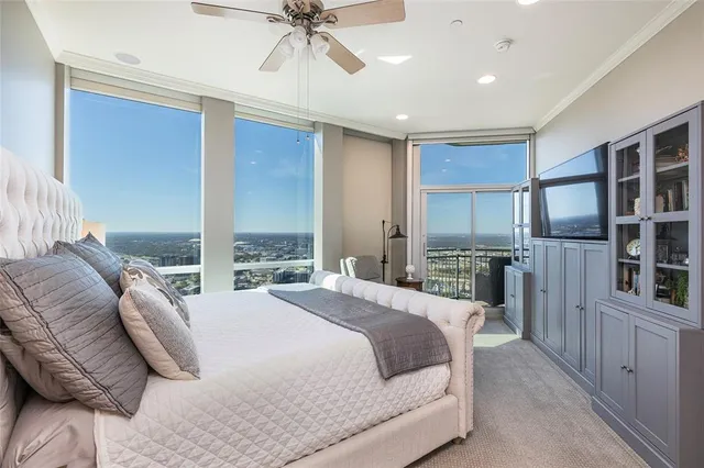 a bathroom with a double vanity sink a mirror a bathtub and shower