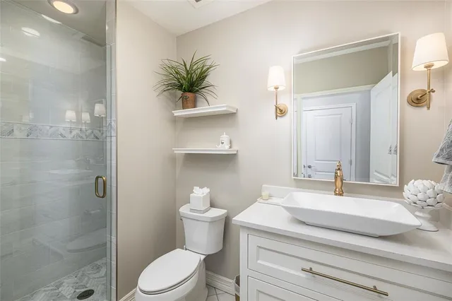 a bedroom with a bed and a television