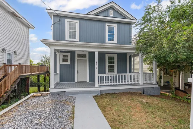 a front view of a house with a porch