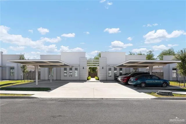 a view of a street that has parked cars