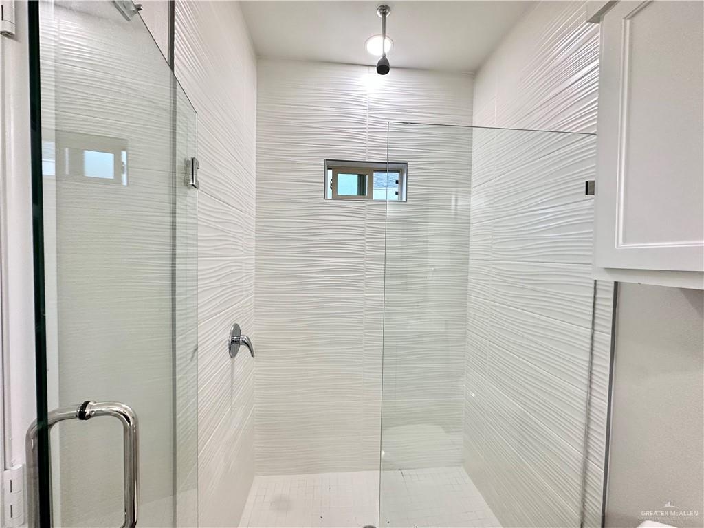 1011 Starr Street Mercedes, TX 78570 - Photo 17 of 35 a bathroom with a shower