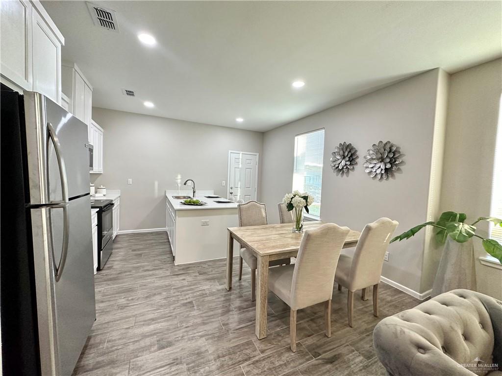 1011 Starr Street Mercedes, TX 78570 - Photo 10 of 35 a kitchen with appliances cabinets and furniture
