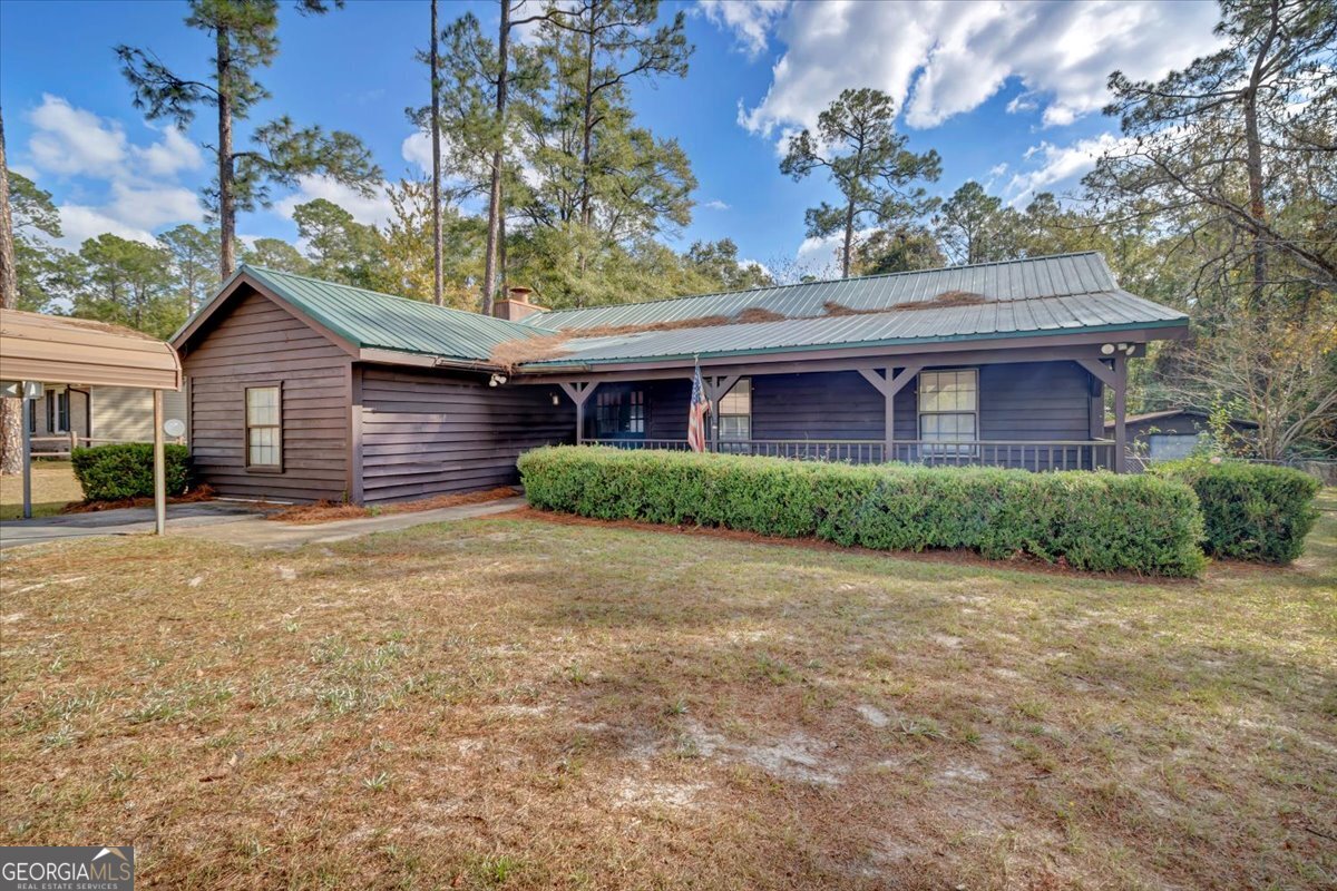 1702 Vada Road Bainbridge, GA 39817 - Photo 2 of 33 a front view of a house with garden