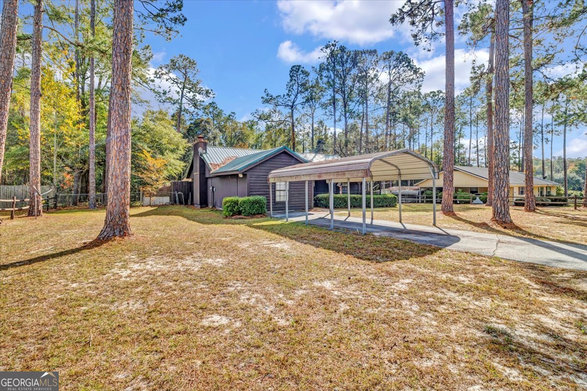 1702 Vada Road Bainbridge, GA 39817 - Photo 23 of 33 a view of house with outdoor space and swimming pool