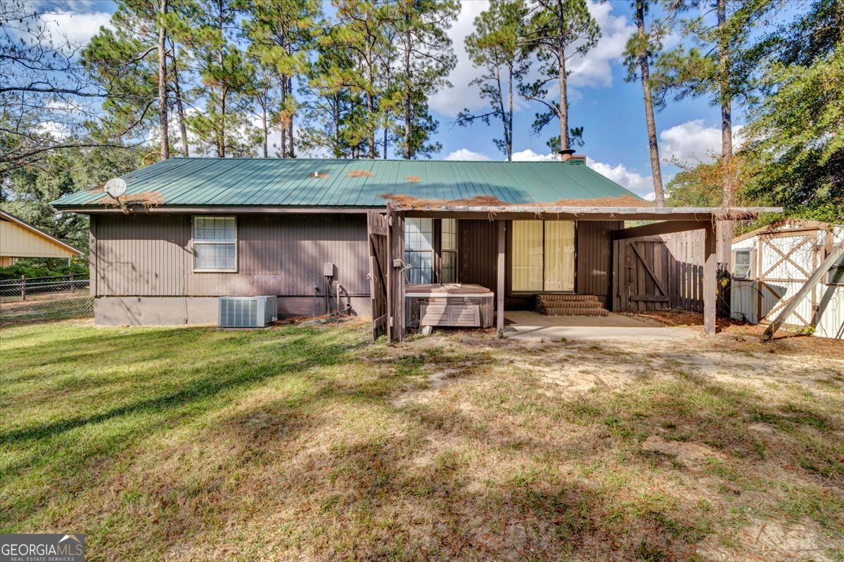 1702 Vada Road Bainbridge, GA 39817 - Photo 26 of 33 a backyard of a house with table and chairs