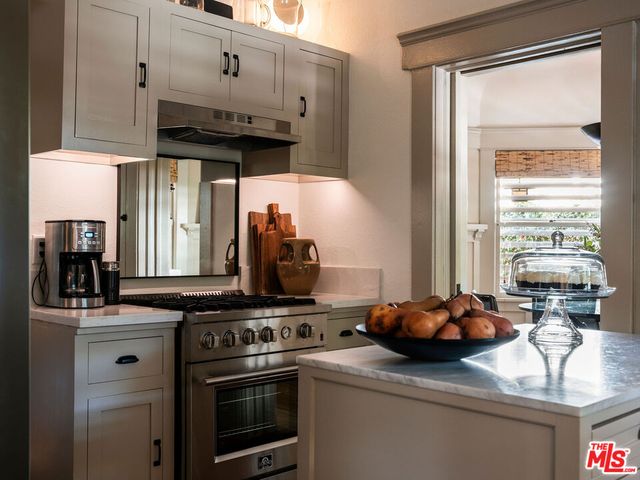 a view of a livingroom with wooden floor and cabinet
