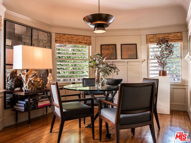 a view of a hallway with wooden floor windows and entryway