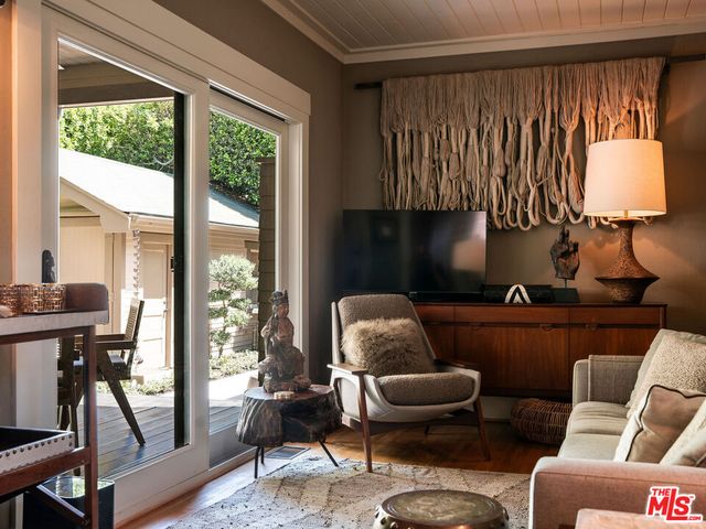 a view of a patio with couches chairs and a potted plant