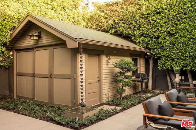 a outdoor living space with furniture and a fireplace