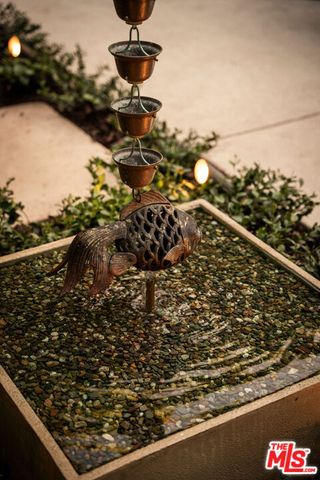 a view of a patio with couches chairs and a potted plant