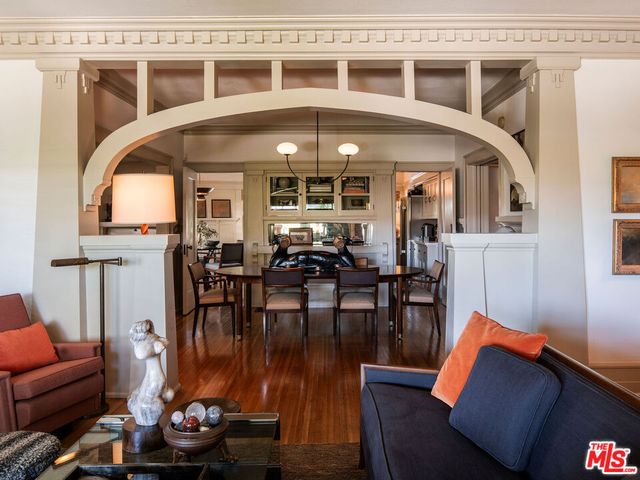 a view of a dining room with furniture window and wooden floor