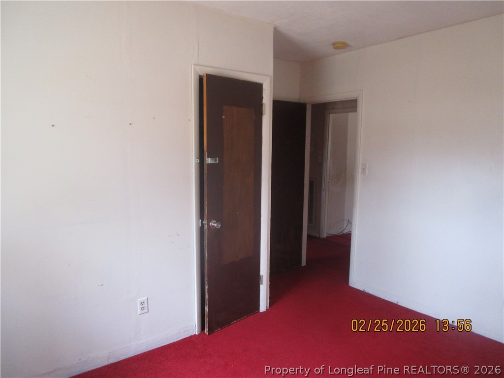 256 Chesters Road Roseboro, NC 28382 - Photo 17 of 22 a view of hallway with closet and wooden floor