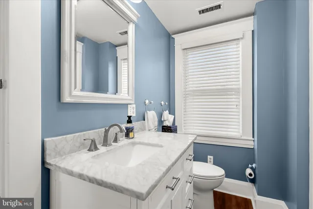 a bedroom with a bed and cabinets