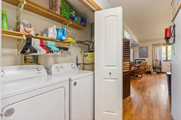 a view of storage utility and utility room with washer and dryer