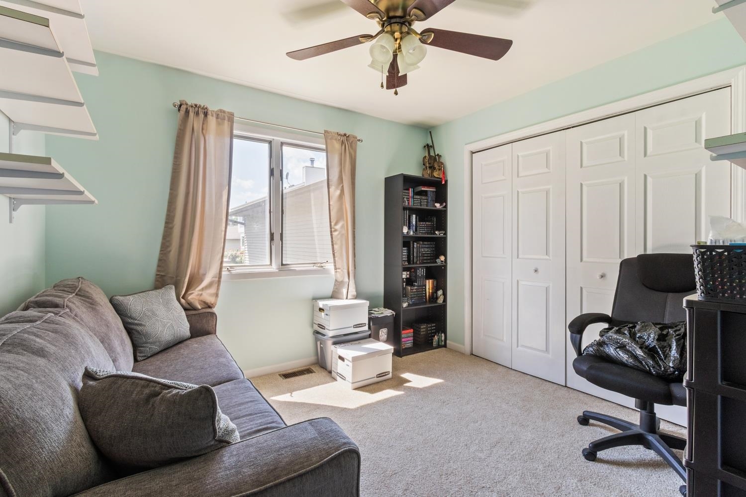 216 Pardridge Place DeKalb, IL 60115 - Photo 17 of 18 a living room with furniture and a window