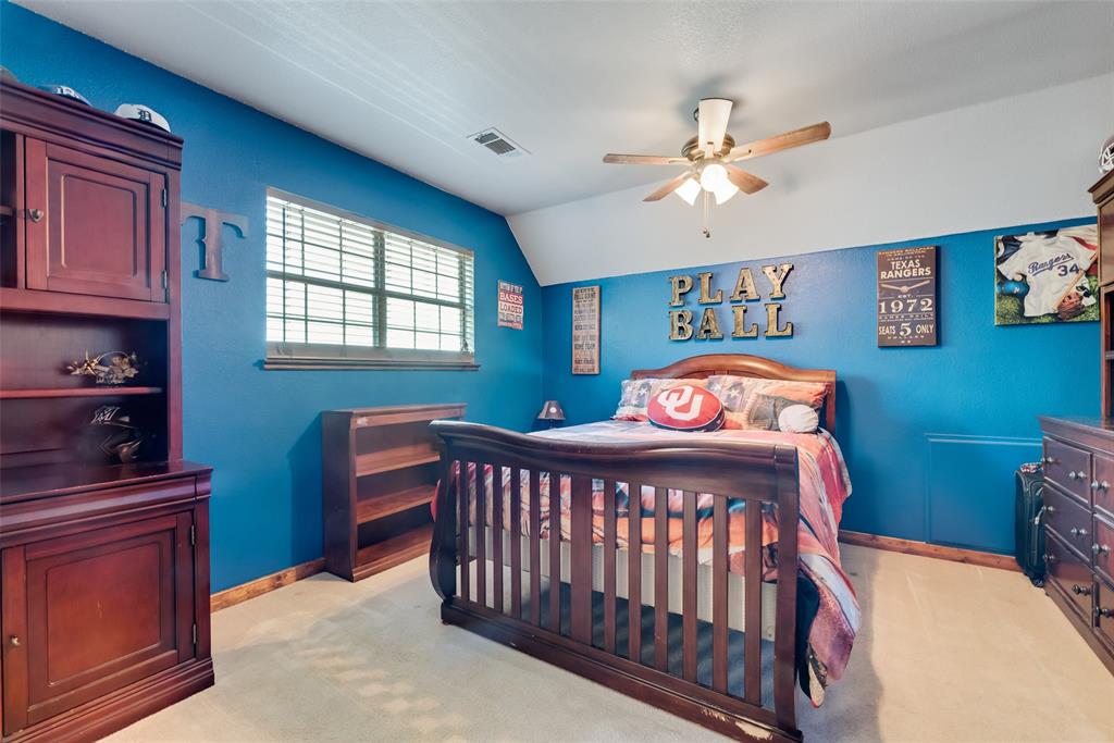 82 Trail Ridge Drive Melissa, TX 75454 - Photo 16 of 29 Large second bedroom featuring light carpet, lofted ceiling, and ceiling fan