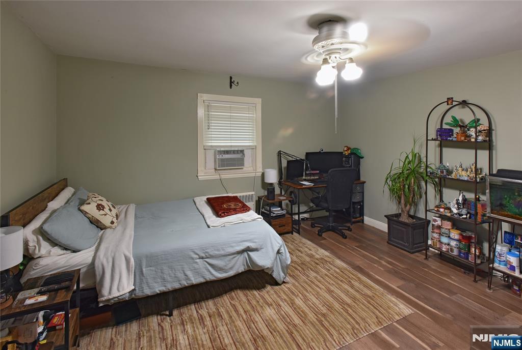 585 Monroe Place Ridgefield, NJ 07657 - Photo 21 of 28 a bedroom with furniture and a window