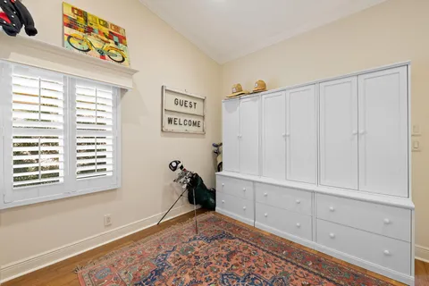 a bedroom with a bed and a lamp with window