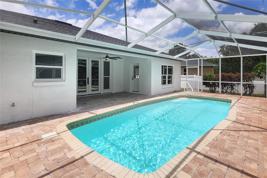 7027 Frascati Loop Wesley Chapel, FL 33544 - Photo 27 of 28 a house with garden in front of it