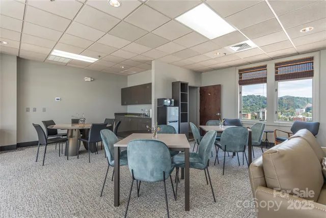 a view of a dining room with furniture window and outside view