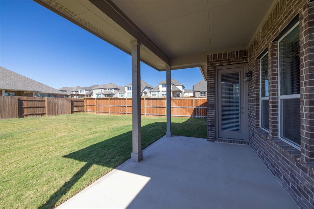 113 Shadow Oak Cove Georgetown, TX 78628 - Photo 36 of 40 A spacious, enclosed yard features a covered patio perfect for outdoor enjoyment.
