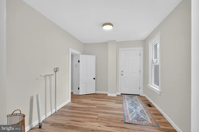 a view of a hallway with furniture