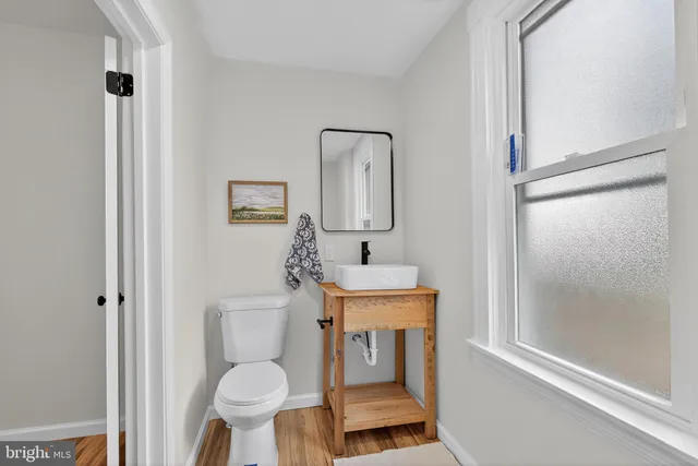 a bed room with a bed and a window