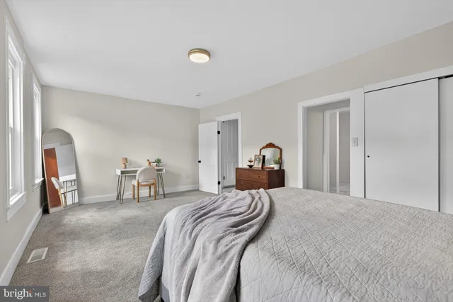 a bed room with a bed and a couch