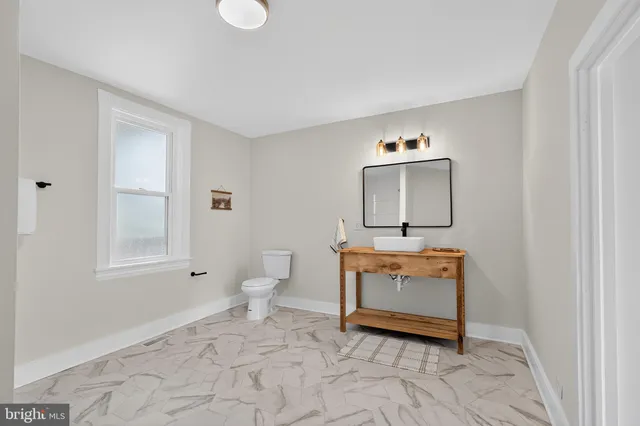 a view of a hallway with stairs