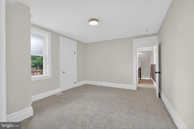 a view of balcony with wooden floor and fence and floor to ceiling window