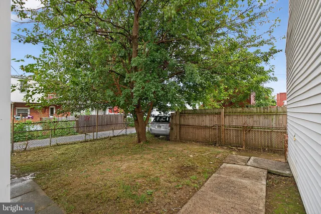 an aerial view of houses with outdoor space