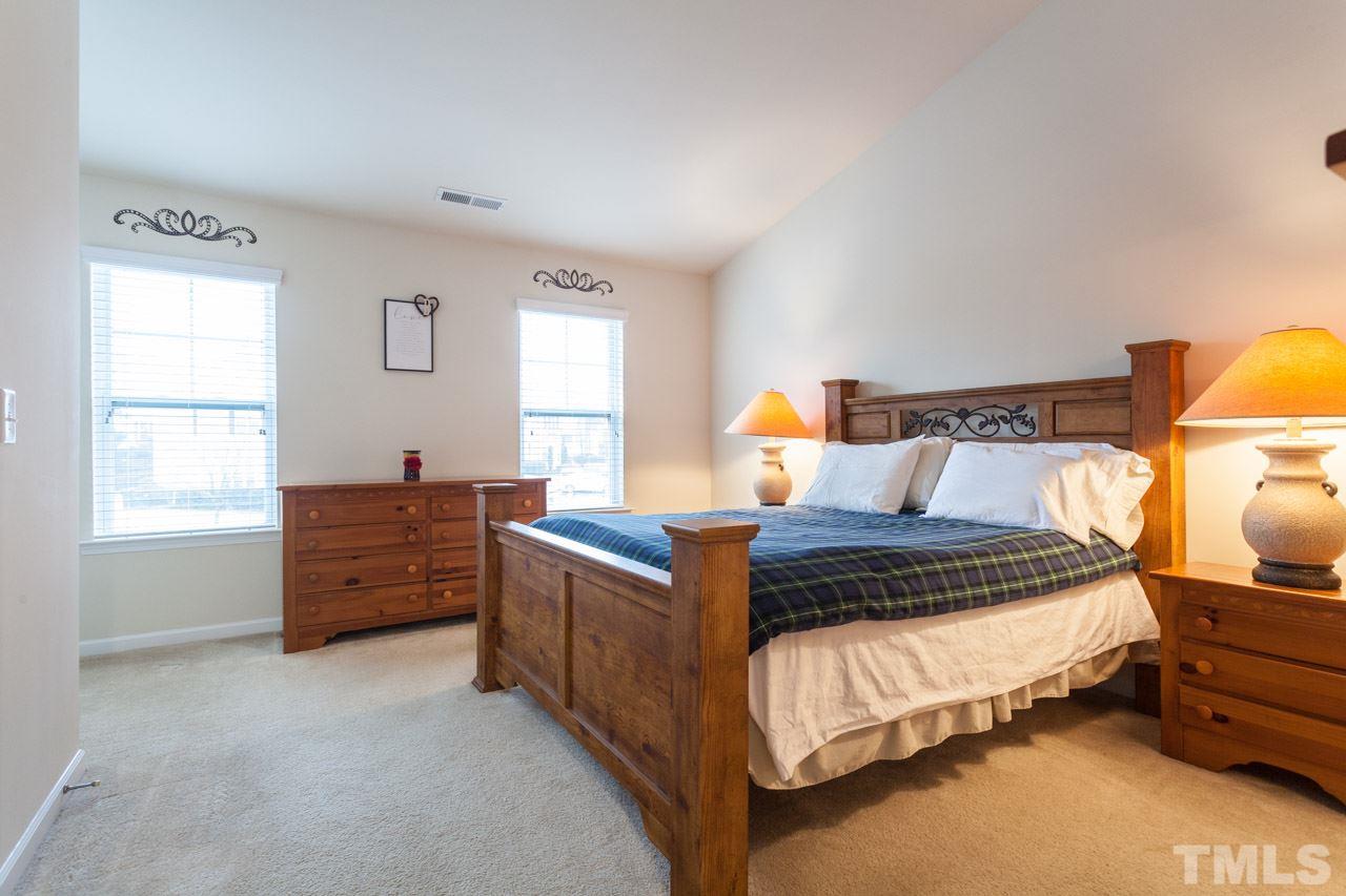 2930 Casona Way Raleigh, NC 27616 - Photo 11 of 25 a bed room with a bed and a window