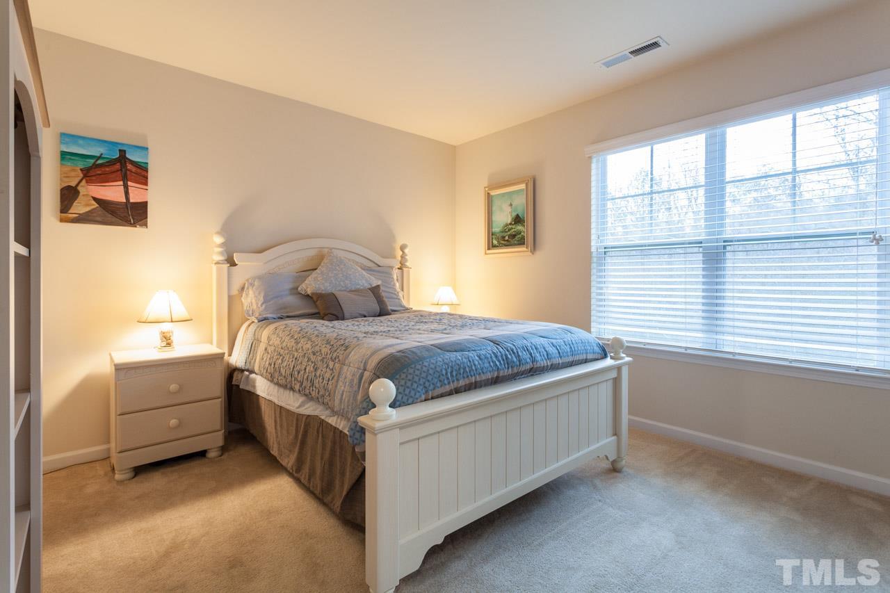 2930 Casona Way Raleigh, NC 27616 - Photo 14 of 25 a bedroom with a bed and a window