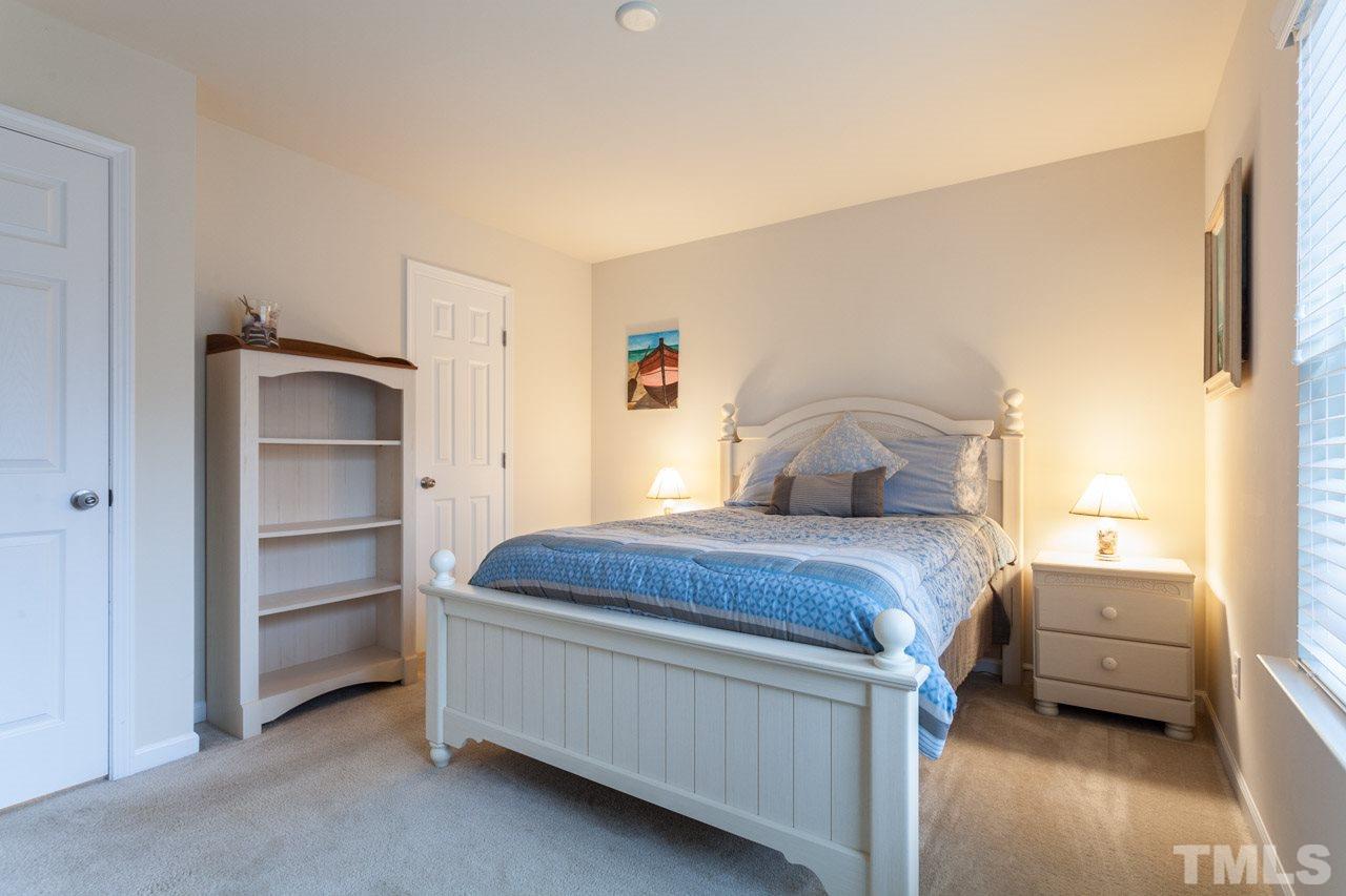 2930 Casona Way Raleigh, NC 27616 - Photo 15 of 25 a bedroom with a bed and a window