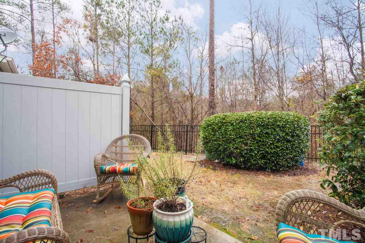 2930 Casona Way Raleigh, NC 27616 - Photo 17 of 25 a room with trees and outdoor seating