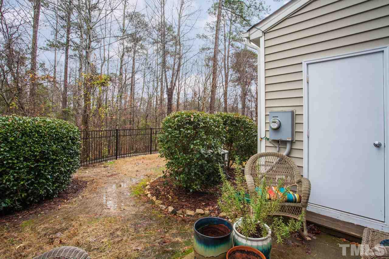 2930 Casona Way Raleigh, NC 27616 - Photo 18 of 25 a backyard of a house with lots of green space
