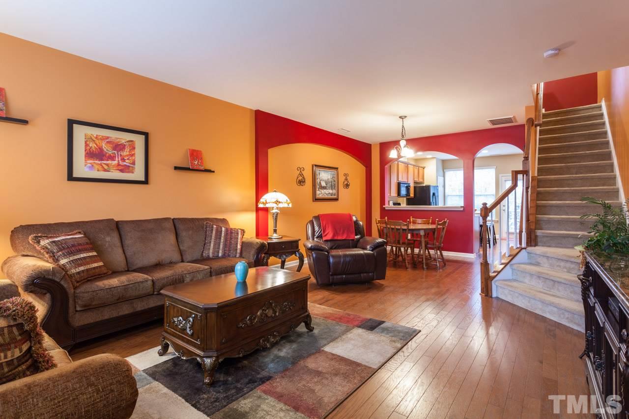 2930 Casona Way Raleigh, NC 27616 - Photo 4 of 25 a living room with furniture and wooden floor