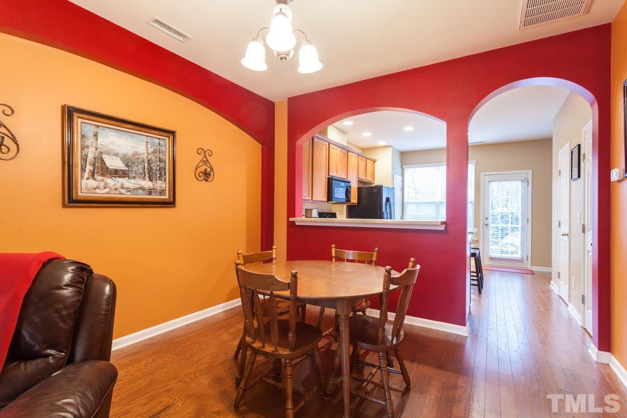 2930 Casona Way Raleigh, NC 27616 - Photo 5 of 25 a view of a dining room with furniture and wooden floor
