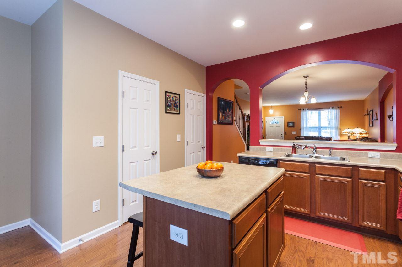2930 Casona Way Raleigh, NC 27616 - Photo 8 of 25 a kitchen with a sink and cabinets